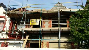 house under construction with scaffolding