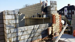 a brick wall of an extension being built