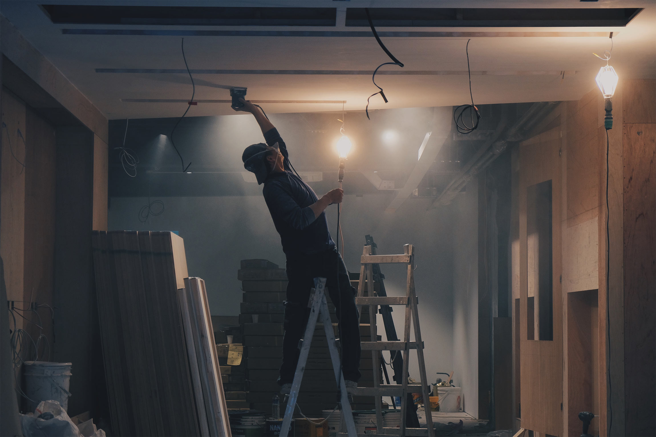 Workers wiring a ceiling